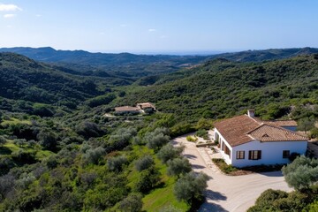 Fototapeta premium This stunning image features a picturesque countryside home surrounded by lush green hills, showcasing a serene and tranquil landscape in nature’s embrace.