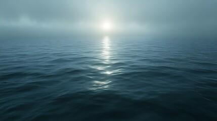 Obraz premium Serene Ocean Sunlight Path Through Misty Waters