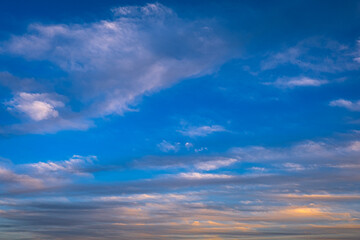 Fototapeta premium clouds at sunset. blue sky. fluffy cirrus clouds.