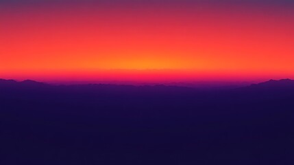 Vibrant Sunset Over Silhouetted Mountain Ranges
