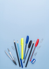 Back to school backdrop. School supply over light blue background with copy space