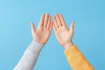 Hands reaching out against blue background, symbolizing connection and unity