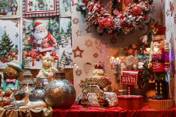 ZAKOPANE, POLAND - DECEMBER O3, 2024: A shop window decorated for Christmas with lots of beautiful toys and figurines.