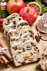 Delicious traditional strudel with dried fruit. Around the cake are beautiful classic Christmas decorations.