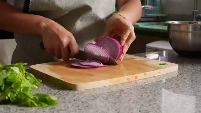 woman chopping tomato to prepare a guacamole typical of mexico 