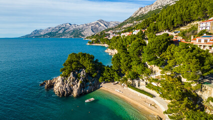 A stunning aerial view of Brela, Croatia, showcasing the iconic Kamen Brela rock formation...