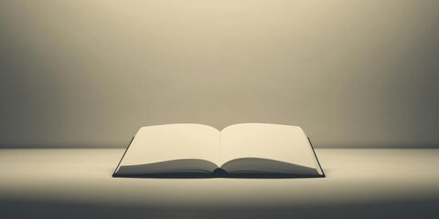 A book is open on a table. The book is white and the pages are blank. The book is open to the middle of the page