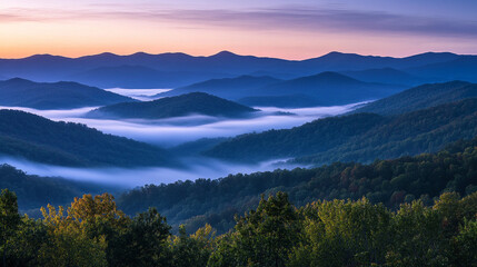 Obraz premium A misty mountain ridge at sunrise, with layers of light and shadow blending seamlessly.