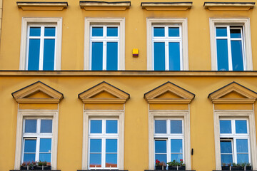 Bright, yellow facade of an old building in Europe 