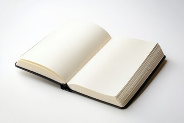 A book is open to a blank page. The book is black and white