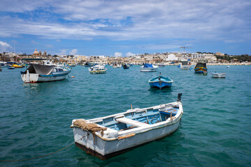 Boats in the harbor in the fishing village of Marsaxlokk on the island of Malta