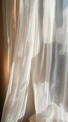 A white curtain with a pattern of squares and triangles. The curtain is open and the sun is shining through it