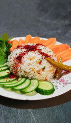 Cooked rice served with raw vegetables and spices vertical with salad, close up high quality, meal name is 