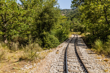 Obraz premium Narrow gauge Odontotos railway in Vouraikos Gorge on Peloponnese peninsula, Greece.