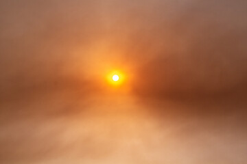 Red sun seen through smoky air from wild fires on Peloponnese peninsula, Greece