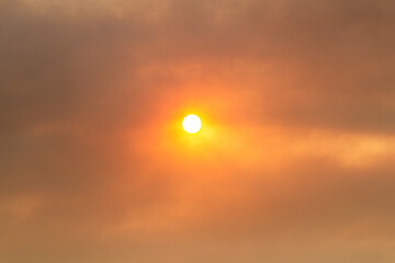 Red sun seen through smoky air from wild fires on Peloponnese peninsula, Greece