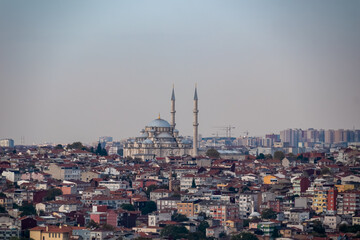 Panoramic view Suleymaniye Mosque in Istanbul, Turkey. Majestic dome and towering minarets against backdrop of the city dense urban landscape. Sense of history, culture and beauty Islamic architecture