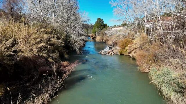 Aerial view of the Cabriel river in winter as it passes through the province of Cuenca, Castilla-La Mancha, Spain with beautiful daylight