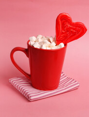 bowl of marshmallows on pink background