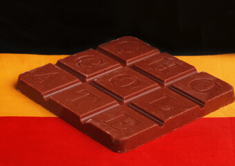 Belgian chocolate bar against the background of the flag
