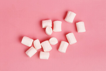 white marshmallow on pink background