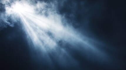 Fototapeta premium Light beams shining through dark clouds.