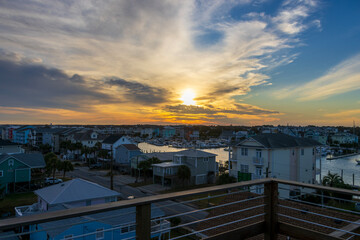 Fototapeta premium a beautiful winter landscape with condos and homes and yachts and boats docked in the water at sunset in Carolina Beach North Carolina USA