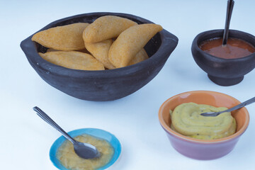 Delicious traditional Colombian empanadas with spicy sauce