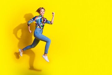 Fototapeta na wymiar Full body photo of attractive young woman running hurry black friday dressed stylish colorful clothes isolated on yellow color background