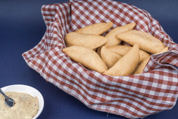 Colombian empanada with spicy sauce 