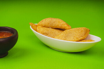Delicious traditional Colombian empanadas with spicy sauce