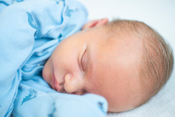 Newborn baby,  14 days old, sleeping.