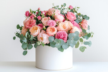 Beautiful bouquet of pink and orange various flowers in a white box