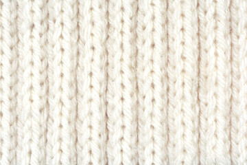 Detailed white wool texture background. Rib stitch knitting pattern. 
