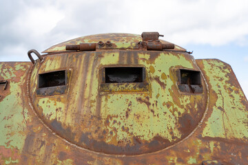 Spyhole of a rusty old soviet military vehicle wreck