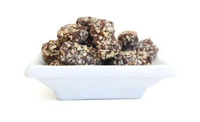 Almond butter chocolate bar candy isolated in bowl on white