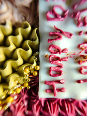 cake with happy writing decorated with flowers and colorful motifs