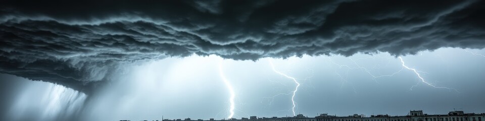 Dramatic Storm Clouds and Lightning Strikes Capture Powerful Tornado Scene Over Open Field During Intense Thunderstorm Weather Phenomenon