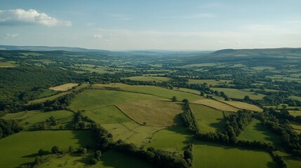 Obraz premium Aerial View of Serene Rolling Green Hills and Farmlands