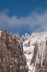 View from the snow-covered valley floor in Yosemite national park during golden hour, just before...