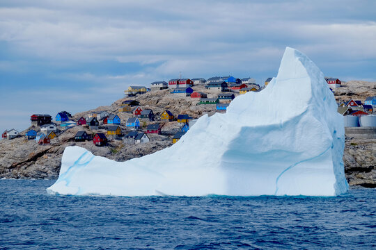 Iceberg in front of the picturesque Uummannaq