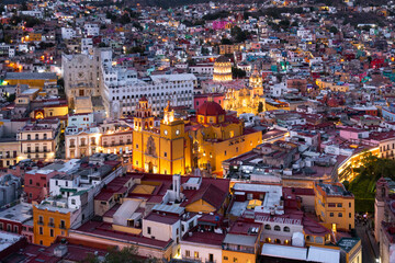 Fototapeta premium Guanajuato City, Mexico, aerial view of historical buildings in evening twilight. Close up of Templo de San Felipe Neri