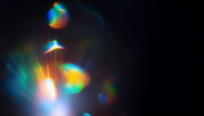 Blurry image of a rainbow with a black background