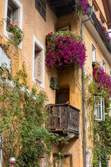 Windows with flower decor of old historic medieval home in Hallstatt, Germany.