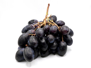 Autumn Royal grapes or seedless black grapes variety isolated on a white background