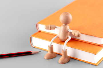 The doll sits on top of the book