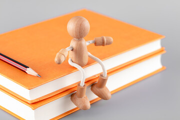 The doll sits on top of the book