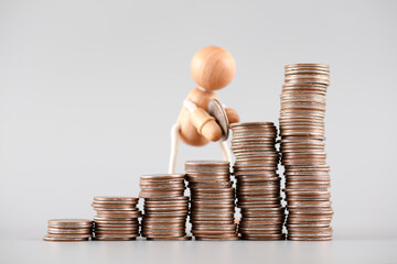 Puppets carry coins to boost economic growth