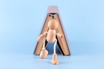 Happy wooden people and books