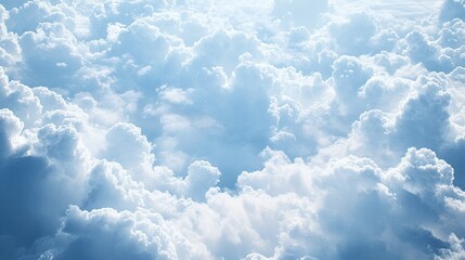 Aerial view of fluffy white and blue cloudscape.